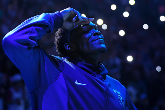 Feb 2, 2024; Minneapolis, Minnesota, USA; Minnesota Timberwolves guard Anthony Edwards (5) salutes the fans as he is introduced as an all-star before the game with the Orlando Magic at Target Center. (Bruce Kluckhohn / USA TODAY Sports).